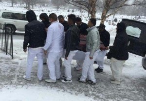  Pallbearers carry the casket with the body of Patricia Sanasie (inset) to the crematorium. 