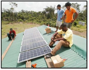 Members of Food For The Poor installing solar panels through the charitable project