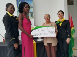 Michelle Robinson (in pink) and representatives from Fly Jamaica during the presentation yesterday