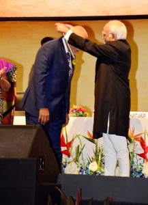President Donald Ramotar receives his award.