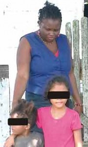 A social worker leaving the house with two of the children yesterday 