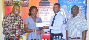 Aqua Mist Brand Manager Errol Nelson (2nd right) hands over the sponsorship cheque to Noshavyah King in the presence of Communications Manager Troy Peters (right) and Brand Manager Colin King.