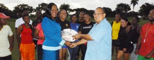 President of the Union Peter Green (right) hands over a kit to Women and Youth Development Officer Petal Adams in the presence of players recently.