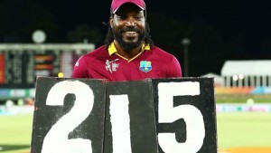 It’s all mine: Chris Gayle holds the scoring plates that shout out his record © ICC.