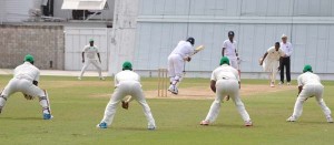 Kyle Corbin on drives Ronsford Beaton for four during his 46 for Barbados Pride yesterday.