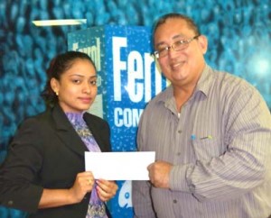 Marketing representative of New GPC Inc. Livasti Bhooplall hands over the sponsorship cheque to Union President Peter Green recently.