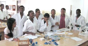 Lab in session: Surrounded by some of his Science students at UG Johns Campus recently.