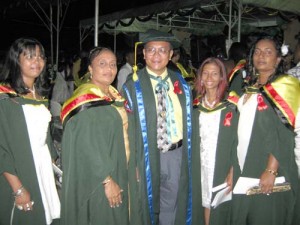 Mr. Hackett, then Coordinator of the Faculty of Social Sciences (UGBC), sharing a graduation moment with some of his Mathematics Degree Graduates.