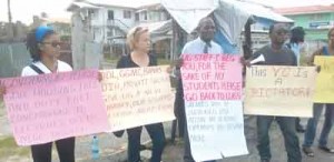 Professor Jacob Opadeyi (second from right) in picketing mode along with others.