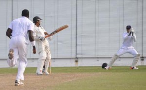 Vishaul Singh rocks his head back to evade a Carlos Braithwaite bouncer during his top score for Guyana yesterday. 