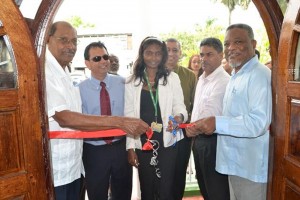 Prime Minister Samuel Hinds & Chairman of the PUC Commission, Justice Prem Persaud, along with CEO of the Guyana Telephone and Telegraph, Radha Krishna Sharma and staff of the PUC officially open the Commission’s new building.