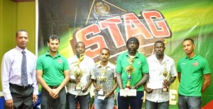 Winners of the top prizes in the East Coast Stag Beer Football tournament along with officials of Ansa McAl take time out for a photo following the presentation.