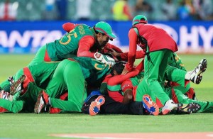 Bangladesh players pile on top of each other after the win, England v Bangladesh, World Cup 2015, Group A, Adelaide, March 9, 2015 ©Associated Press