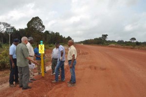 Robeson Benn Minister of Public Works and Communication and other officials at the starting point of the Linden/Lethem roadway.