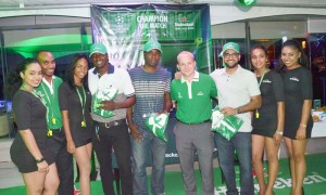 Heineken’s Brand Manager, Robert Hiscock (fourth, right) poses with the various Foosball winners along with models at the launch of the UCL Promotion Saturday night at the Gravity Lounge.