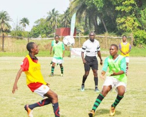 Ryan Hackett of defending champion Lodge (right) battles for possession in their quarter-final game against St. Mary’s last week.