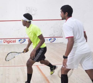 Nyran Joseph (left) & Jason Khalil in action during a high intensity Open final of the Bounty Farm tournament at the GT club earlier this month.