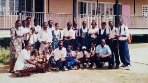 Our ‘Special Person’ (stooping at centre) with a group of teachers upon the completion of the Inter-School Sports at Winifred Gaskin Memorial Secondary in the 1990s