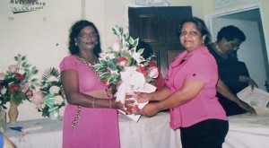 Dayaram (L) being honoured by Guyanese Women In Development (GUYWID) as an ‘Outstanding Woman’