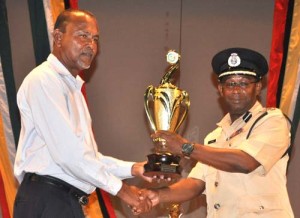 Commander of Police ‘A’ Division Clifton Hicken collects the first prize for Semi-Costume Large Band category