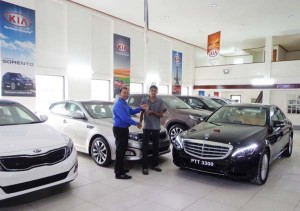 The keys being handed over to Mohamed- Director of DAX contracting services by Seoprashad, sales and marketing manager.