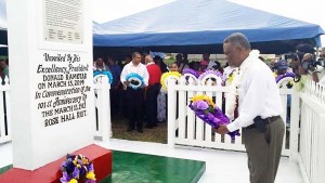 PM Hinds laying a wreath at the monument.