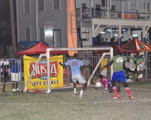 Former national striker Anthony Abrams (left) scores in their clash against West Back Road on Sunday.