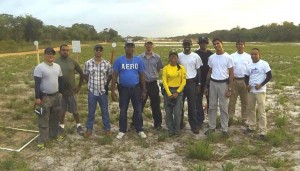Competitors pose with the Range Master on the magnificent GDF Range, after a safe match.