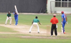 Gaursnshu Sharma gathers runs off his legs off left-arm spinner Ashmead Nedd during his gritty 36 yesterday.