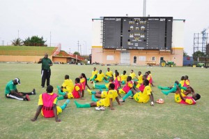 Golden Jaguars Head Coach Jamaal Shabazz (standing) reviewing yesterday’s session at the National Stadium, Providence.