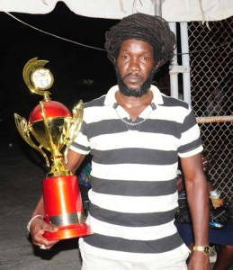 King Dominoes Guyanese Gordon Stephens with his prize 