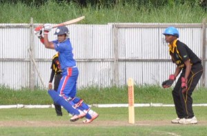 Guyanese-born USA Skipper Chetram Persaud, who followed up his 3-23 with his team’s top score at Wales yesterday, hammers one through cover. 