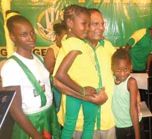 Prime Ministerial candidate Moses Nagamootoo swamped on stage by children from Golden Grove