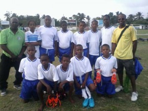 Ordis FC U-13 team along with Coaches pose for a photo opportunity on Saturday at the Tucville Ground.
