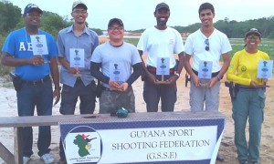 Prize winners display their rewards.