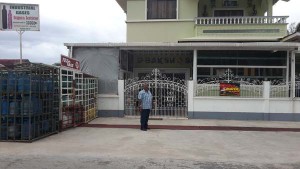 Karim outside his First Avenue, Bartica home and business place.