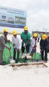 President Donald Ramotar (second from left) in the company of Minister Irfaan Ali (third from left) and other officials of TAU participate in the ceremonial groundbreaking. 