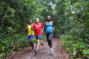 Leading local distance athletes Cleveland Forde (left) and Alika Morgan, flanks lead organizer Sevak Tsaturyan on a practice run during a visit to the Mission.