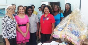 Members, friends of Help and shelter and the president of the Inner Wheel Club of Georgetown Central, at the presentation of the toiletry hamper, recently.