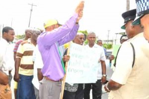 Police during a standoff between City Mayor Hamilton Green, Opposition members and others yesterday in Kingston.