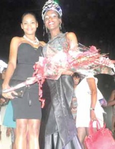 Proud moment: Keisha Fraser savours victory with her designer Crystal Lam. 
