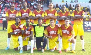 SV Nishan 42 FC, Guyanese Andrew Murray is stooping 2nd left. Standing are Anthony Benfield (2nd right), Quincy Adams (left) and Kestor Jacobs (2nd left). 