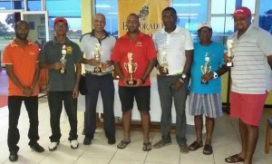  From left, Manager Larry Wills, Sam Harry, ‘Pur’ Persaud, ‘Max’ Persaud, Alfred Mentore for William Walker, Kishan Bacchus and Troy Cadogan after the presentation.