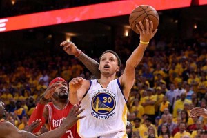 Golden State Warriors guard Stephen Curry (30) shoots a layup against Houston Rockets forward Josh Smith (5) during the fourth quarter in game one of the Western Conference Finals of the NBA Playoffs at Oracle Arena. (Kyle Terada-USA TODAY Sports)