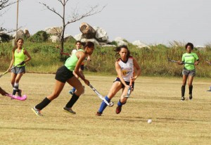 GCC goalscorer Trisha Woodroffe (white jersey) and Hikers Shundel Durant battle for possession in their encounter.