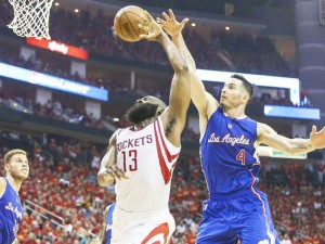 James Harden (13) attempts to score as guard JJ Redick ($) defends. (Troy Taormina, USA Today Sports)