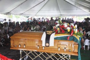 Lewis belt is draped over his casket along with the Golden Arrowhead, a fitting tribute to his contribution to Guyana.
