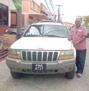Mandricar Persaud and his Jeep Cherokee.