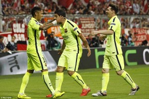 Neymar, Luis Suarez and Lionel Messi celebrate together as Barcelona booked their place in the Berlin Champions League final on June 6. 