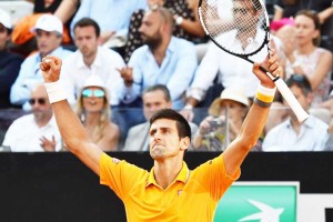 Novak Djokovic of Serbia celebrates after winning the men’s final match against Roger Federer at the ATP Tennis Open on May 17, 2015 at the Foro Italico in Rome (AFP Photo/Gabriel Bouys)